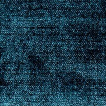 Teal fabric sample displaying a dense, granular texture with horizontal striations and a matte finish; Constantini Pietro label visible.